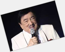 Dolphy Average body,  black hair & hairstyles