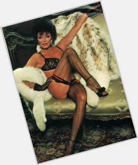 Joan Collins Average body,  dark brown hair & hairstyles